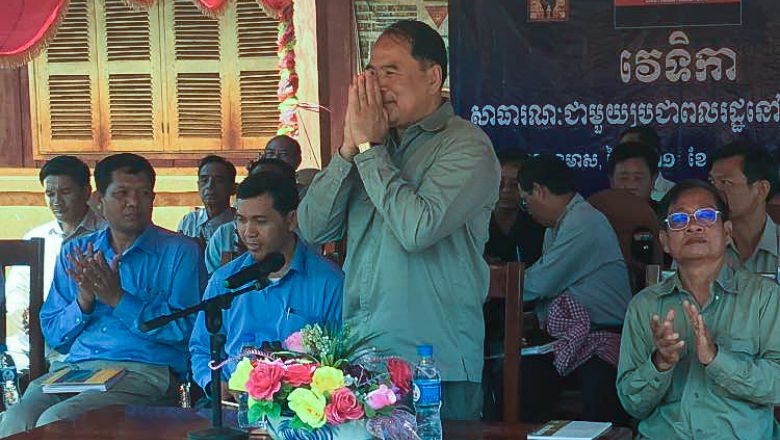 The senior minister in charge of special missions, Ly Thuch (centre), greets ethnic villagers on Tuesday in Ratanakkiri province during a public forum that addressed land disputes. Photo supplied